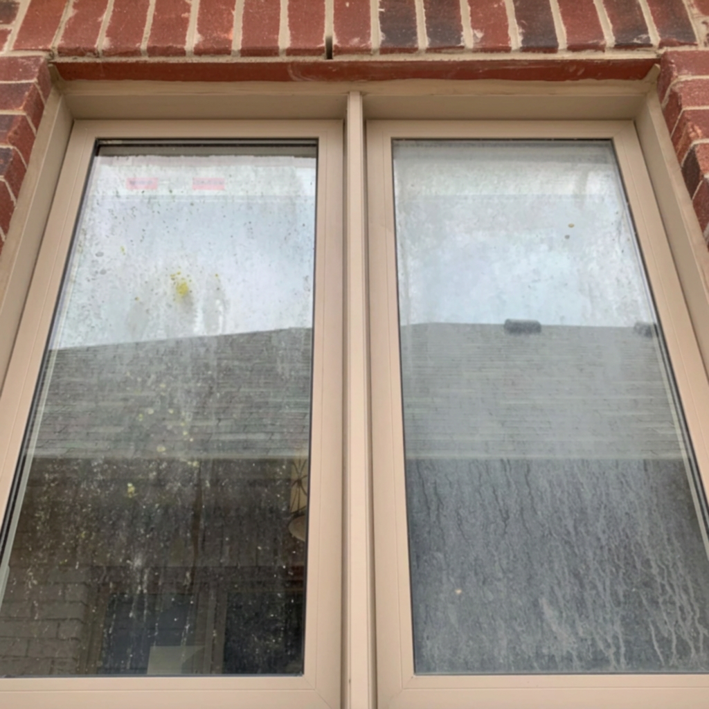 Dirty residential window before Crystal Works cleaning